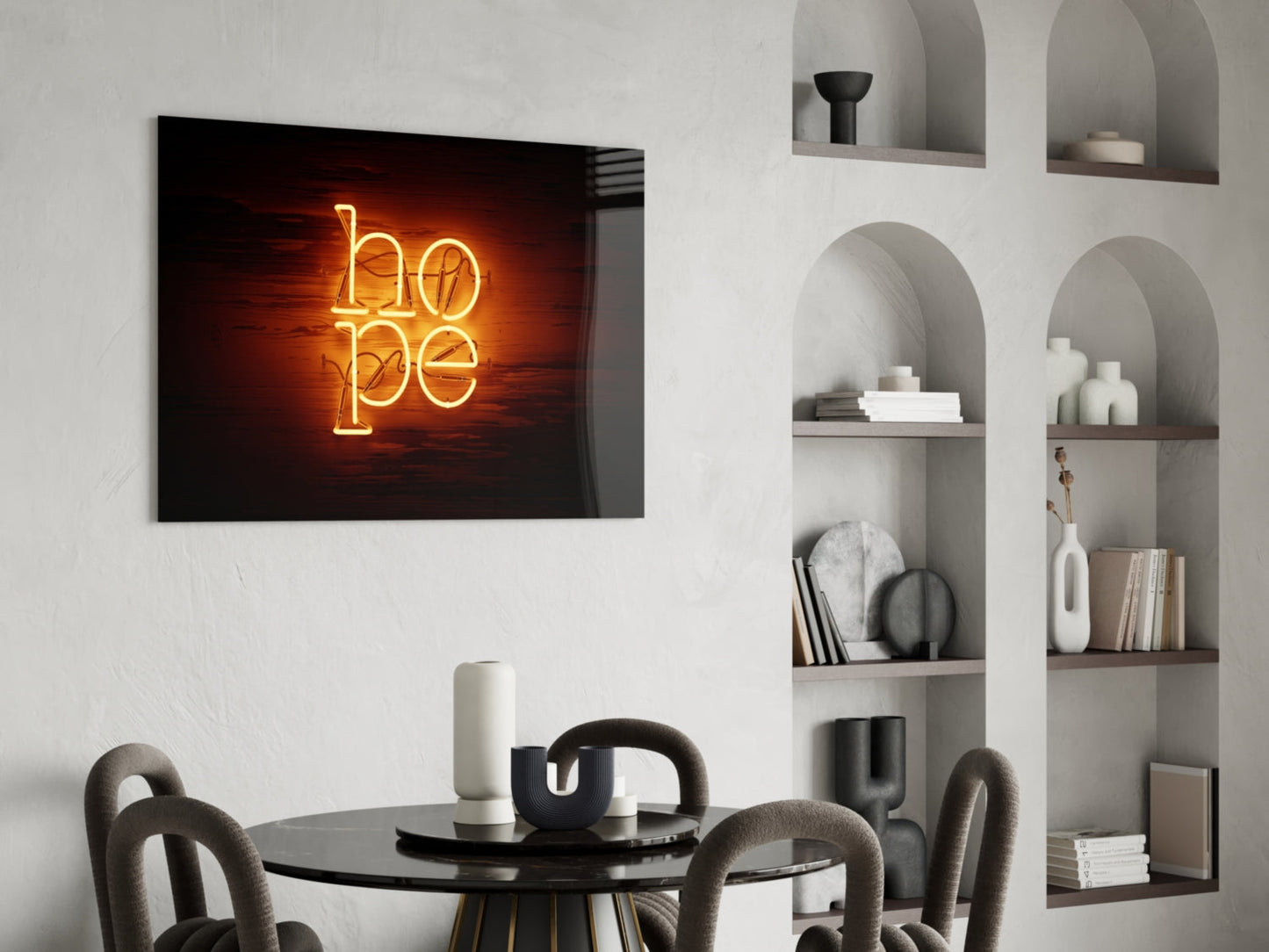 Golden neon "hope" sign mounted on white wall above black dining table with gray chairs and built-in shelving.