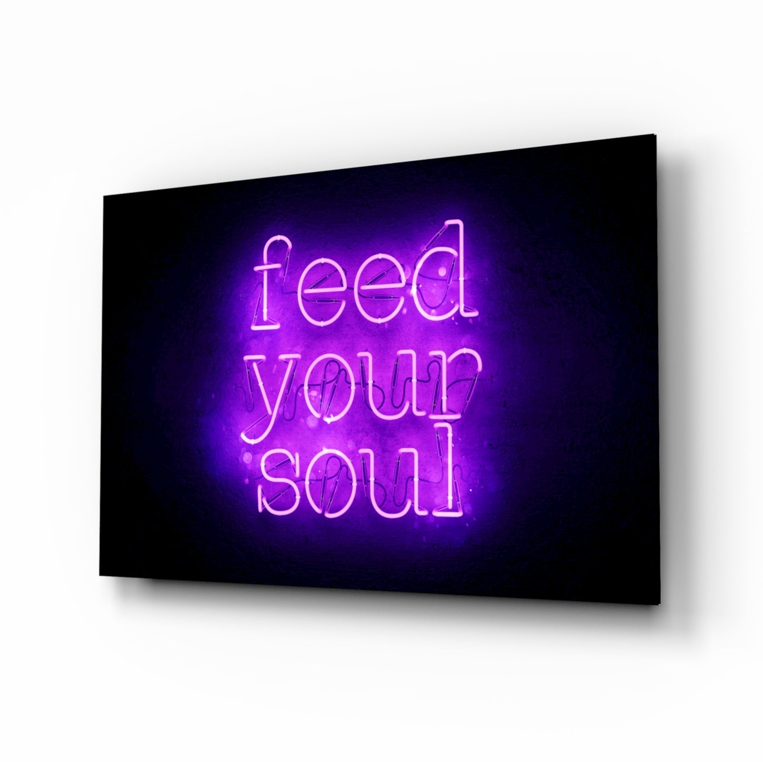 Purple neon "feed your soul" text glowing on black glass wall art panel, angled perspective view.