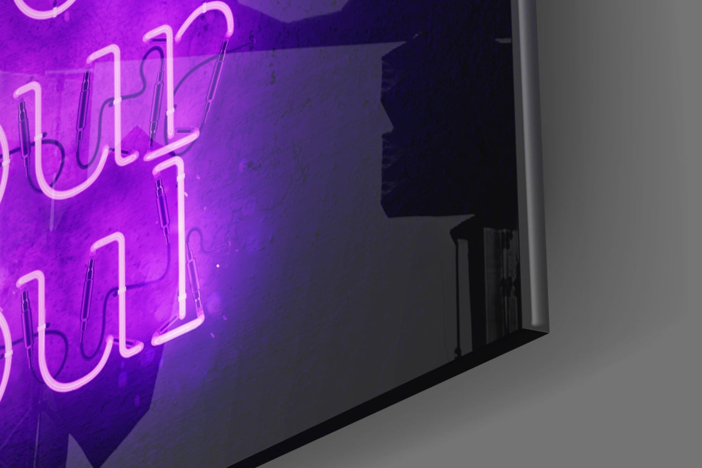 Purple neon glass wall art with "Feed Your Soul" text installed on dark wall, angled perspective view.