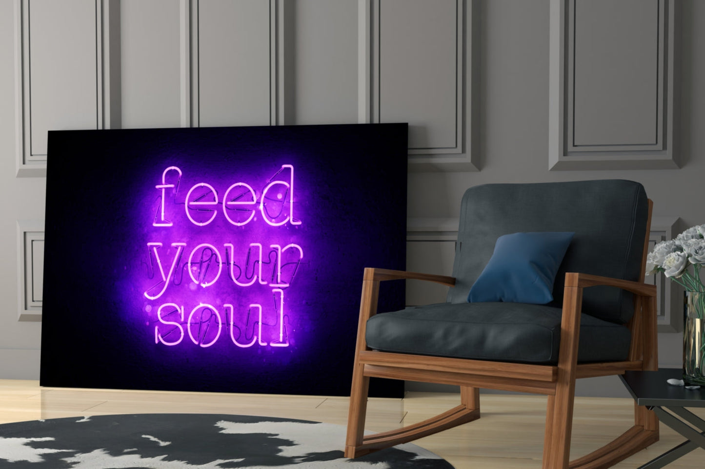 Purple neon "Feed Your Soul" glass wall art displayed on a dark screen next to a wooden-framed armchair in a modern interior setting.