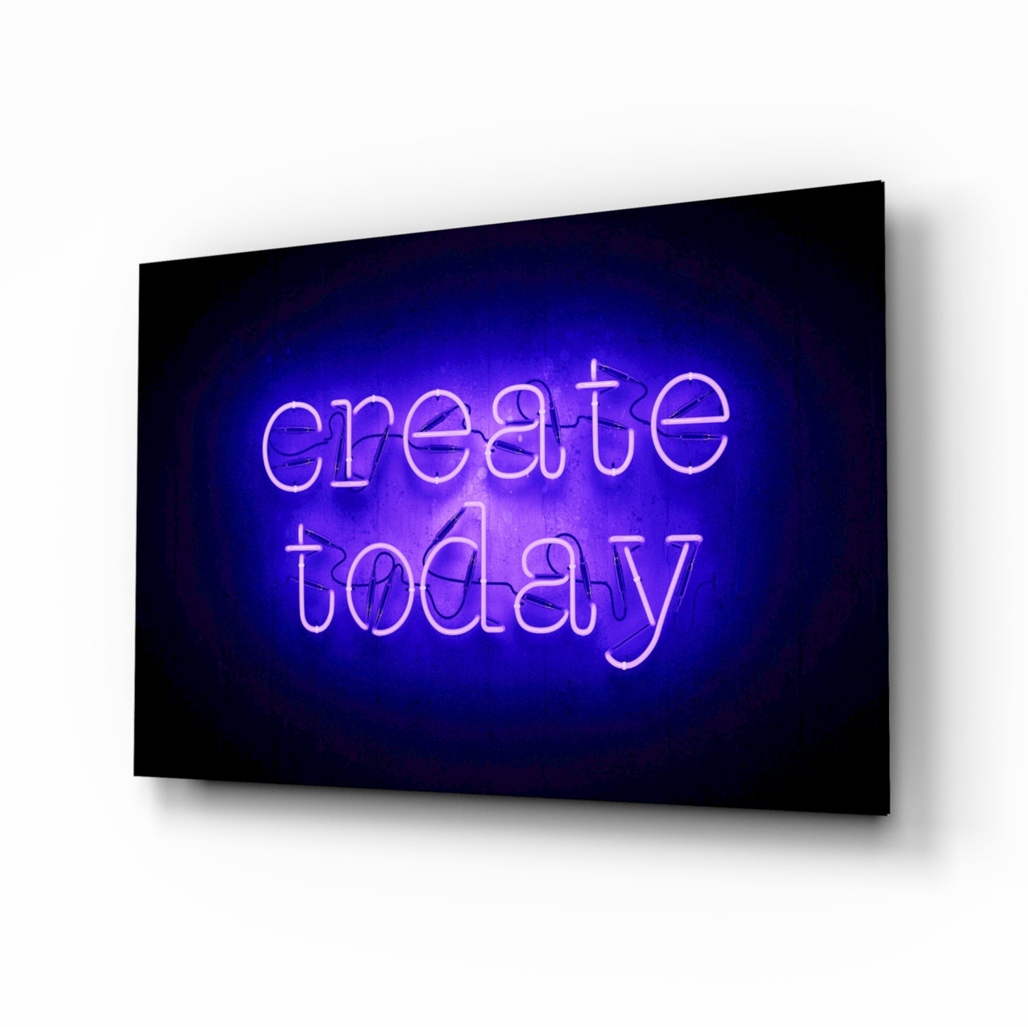 Blue neon "create today" text glowing on black glass panel displayed at an angle against white background.