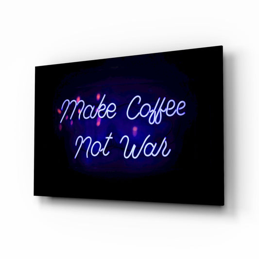 Angled perspective view of black glass wall art with blue and pink neon-style "Make Coffee Not War" text glowing against dark background.
