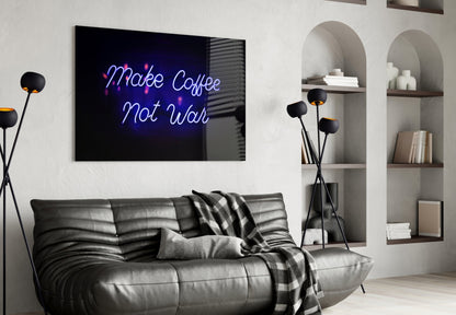 Neon blue "Make Coffee Not War" glass wall art displayed above a black leather sofa in a modern living room.