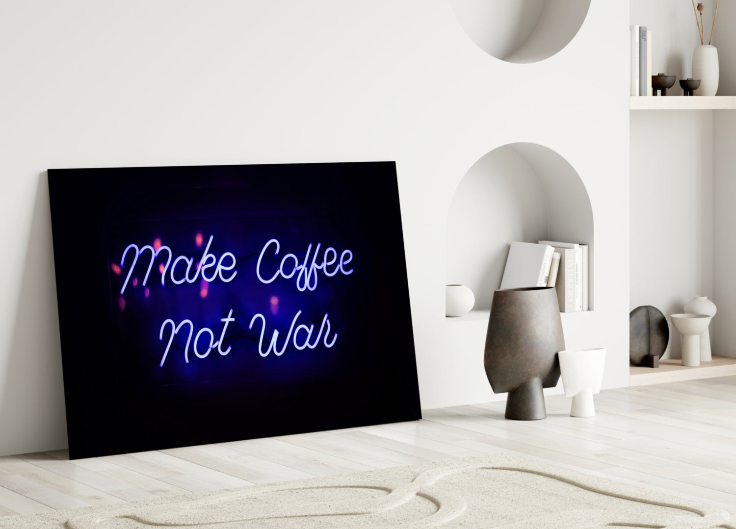 Black glass panel with blue and pink neon-style "Make Coffee Not War" text displayed in minimalist white room setting with shelving and decorative objects.