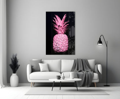 Pink pineapple glass wall art displayed above white sofa in minimalist monochrome living room setting.
