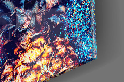 Close-up angled view of glass wall art displaying vibrant fire and blue particle effects with luminous yellow, orange, and cyan colors.
