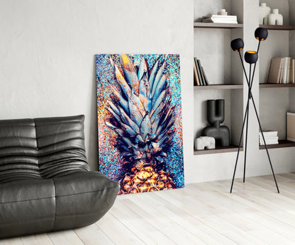 Colorful pineapple glass art displayed in modern living room with black leather chair, shelving unit, and tripod floor lamp.