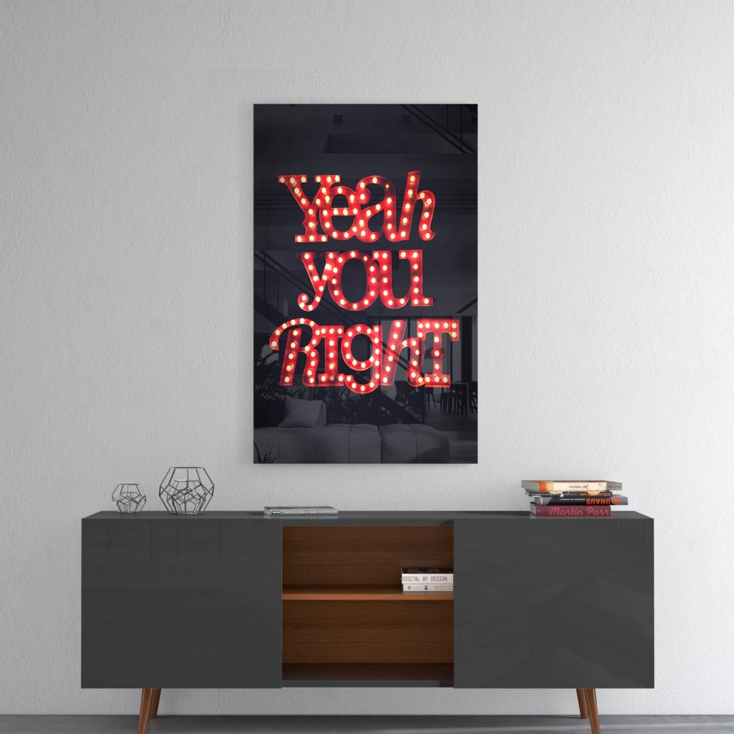 Red neon "Yeah you right" glass wall art displayed above a mid-century modern console table with geometric decor.