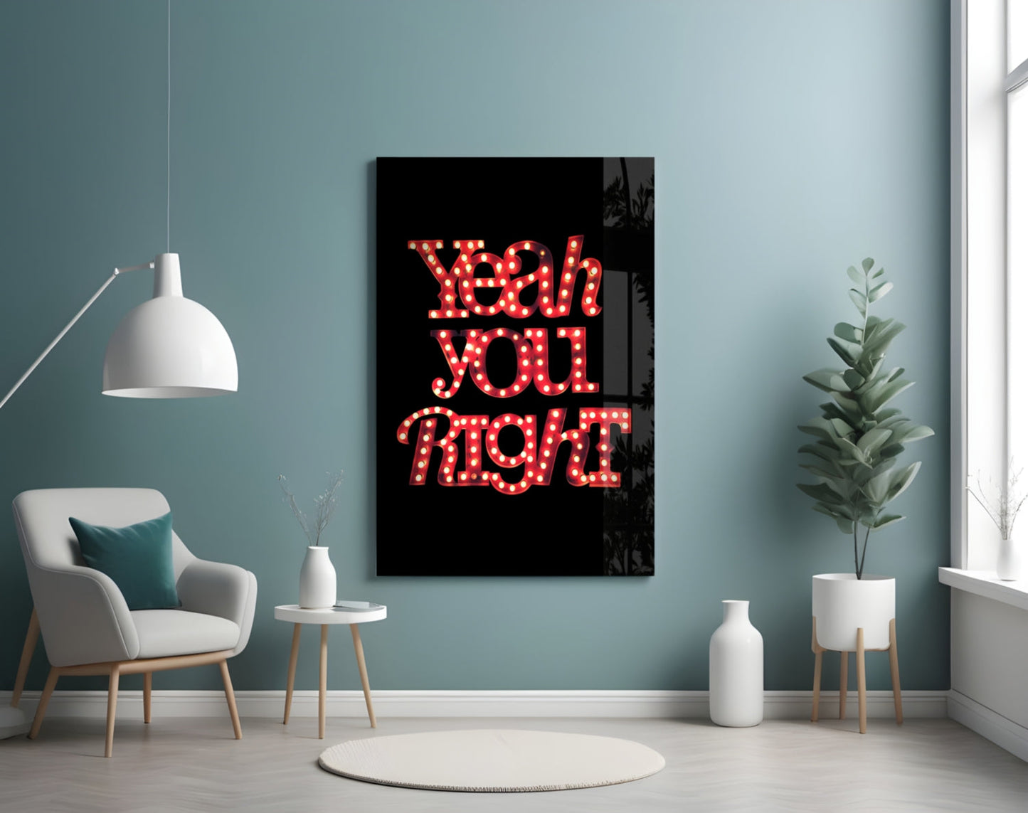 Red neon "Yeah you right" text on black glass mounted on turquoise wall above white chair and potted plant.