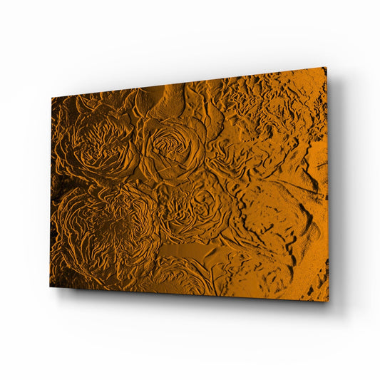 Angled perspective view of amber gold glass wall art with embossed rose and abstract texture patterns, casting shadows.