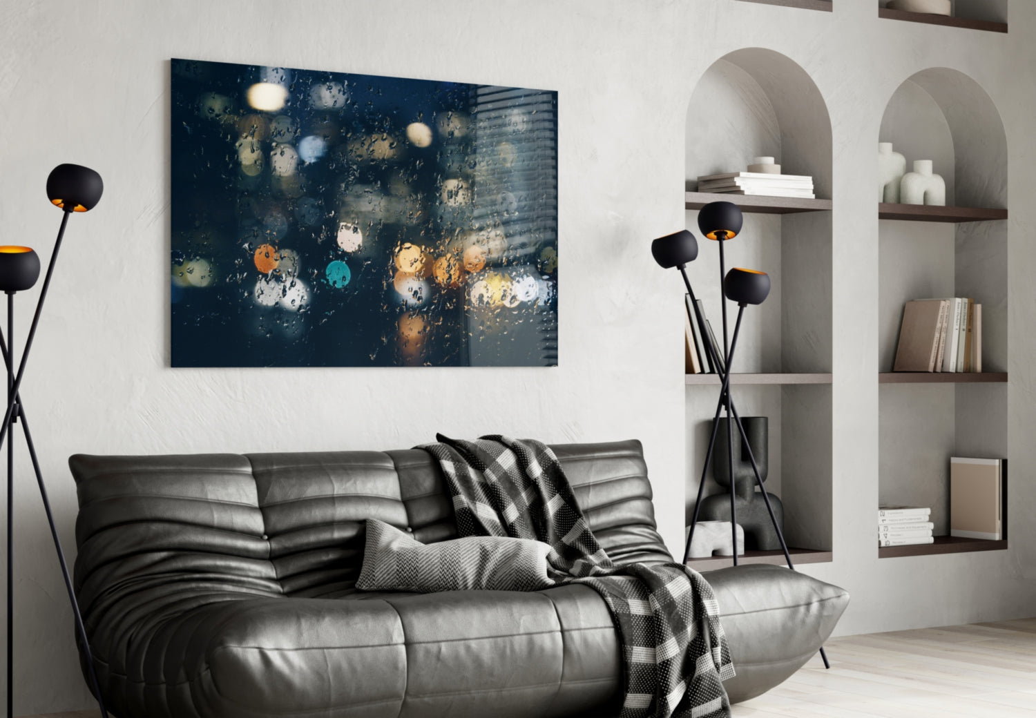 Dark blue rain-streaked glass wall art displayed above a black leather sofa in a modern living room setting.