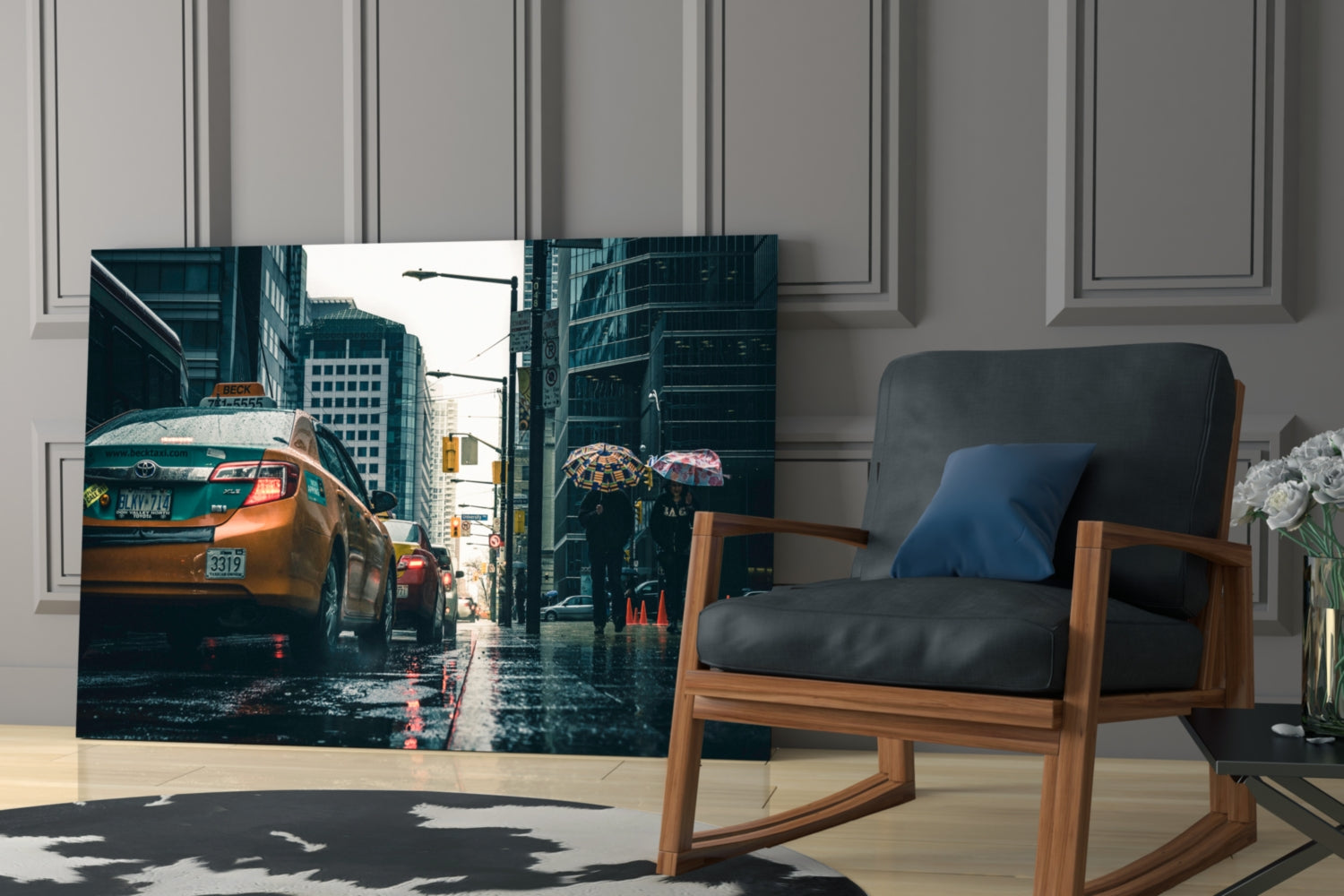 Glass wall art depicting a wet New York City street with yellow taxi and pedestrians with umbrellas, displayed in modern living room setting.
