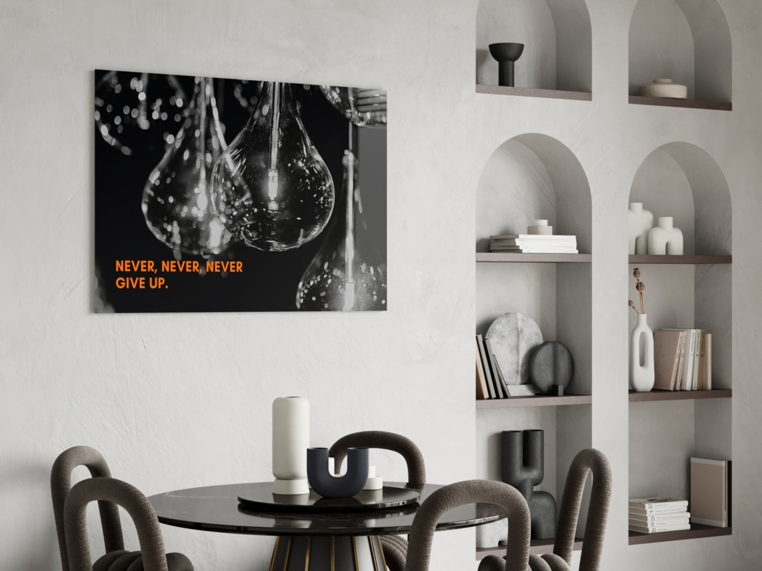 Black and white water droplet glass wall art with orange "NEVER, NEVER, NEVER GIVE UP" text displayed above dining table.