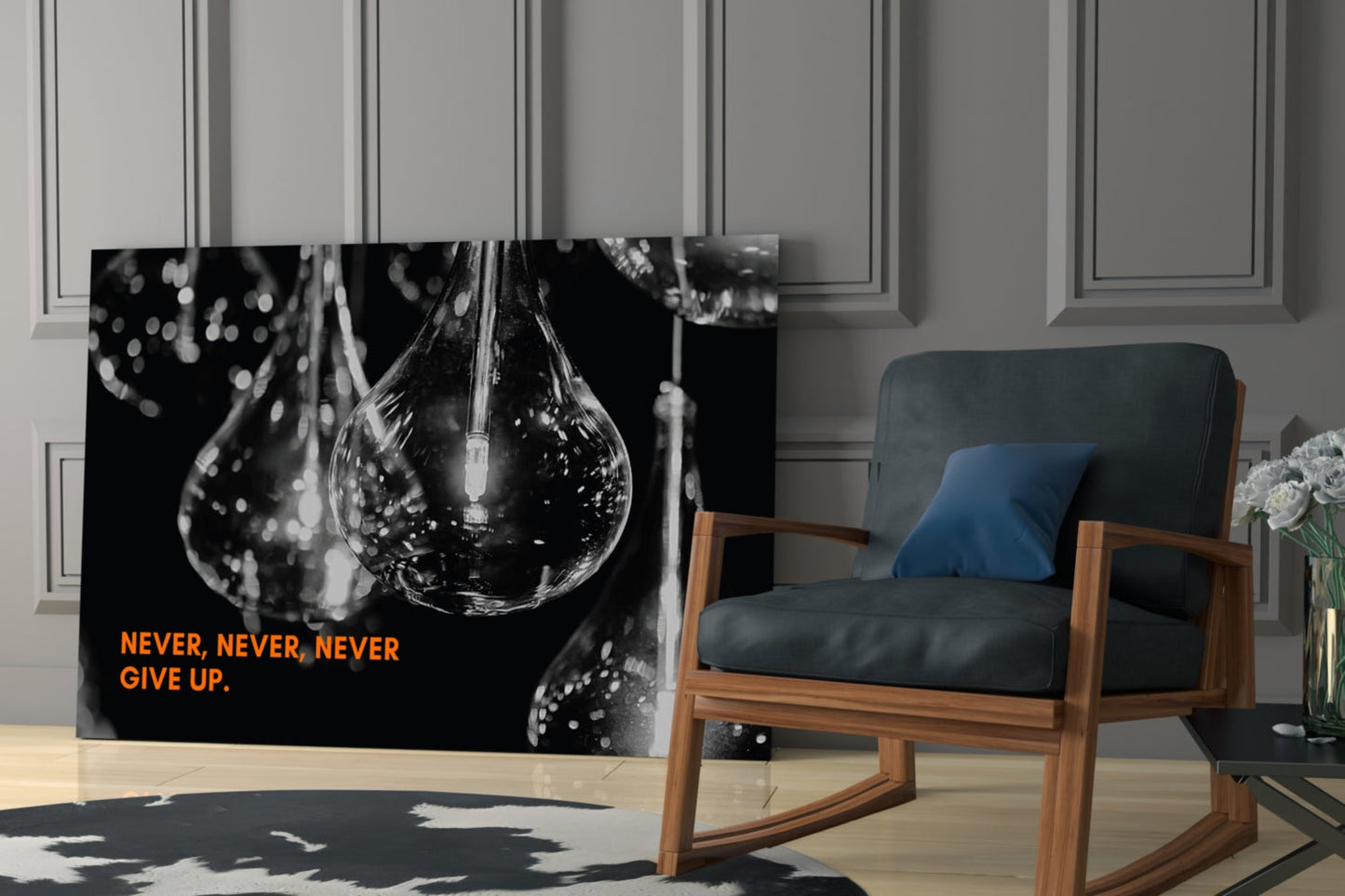 Black and white glass wall art featuring a water droplet with "NEVER, NEVER, NEVER GIVE UP" in orange text, displayed in a modern living room setting.