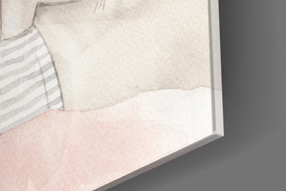 Close-up angled view of framed glass art showing striped fabric and soft pink tones against neutral background.