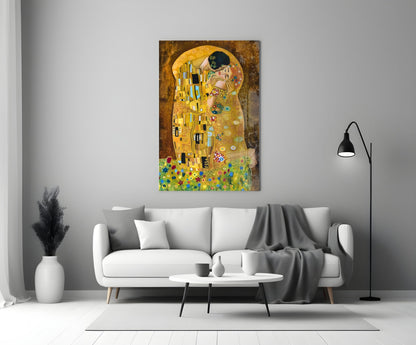 Gustav Klimt "The Kiss" glass wall art displayed above a white sofa in a minimalist living room interior.