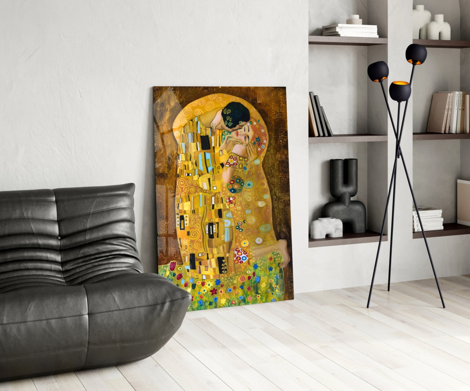 Gustav Klimt "The Kiss" glass art leaning against wall in modern living room with black sofa and shelving.