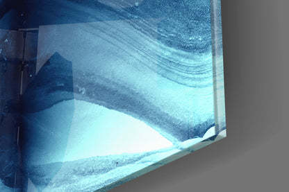 Close-up of textured blue and white glass panel showing layered abstract design with frosted surface detail.