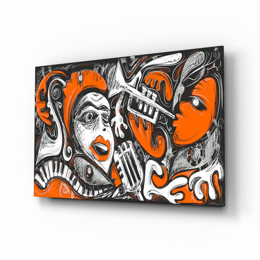 Angled view of glass wall art featuring cubist portrait with orange and black geometric faces, piano keys, and decorative swirls on dark background.