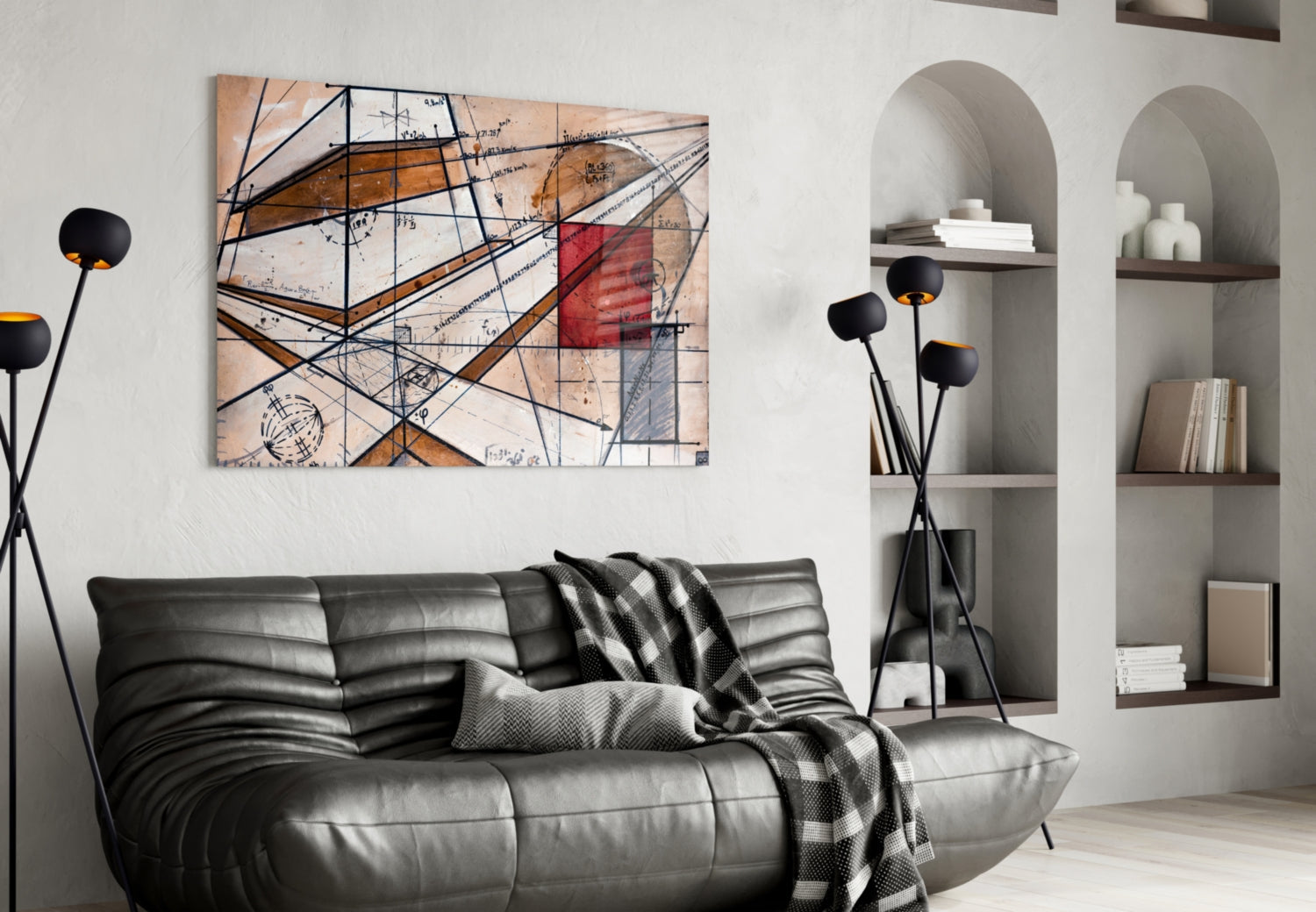 Modern living room featuring abstract glass wall art with geometric lines, blueprint elements, and rust-orange accents above black leather sofa.