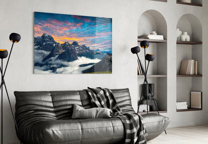 Fiery Sunset Clouds Over Rocky Peaks Glass Wall Art