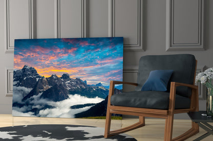 Fiery Sunset Clouds Over Rocky Peaks Glass Wall Art