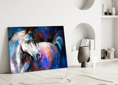 Colorful abstract horse portrait glass art leaning against white wall in minimalist room setting.