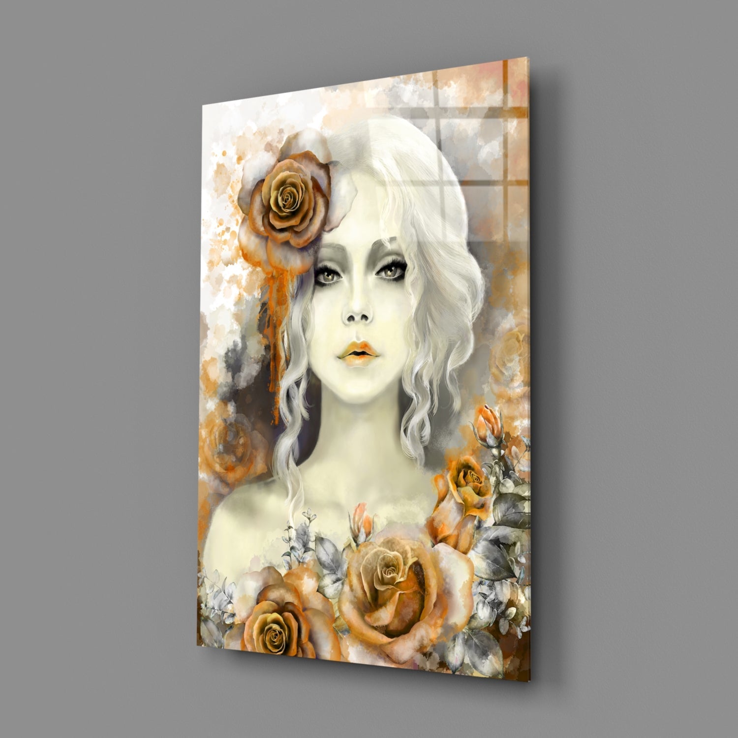 Glass wall art panel displaying a pale-faced woman with wavy white hair adorned with golden roses, surrounded by watercolor floral elements in amber and cream tones.