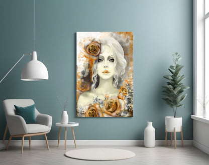 Glass wall art featuring a pale woman with white wavy hair adorned with golden roses against textured cream and orange background, displayed in modern room setting.
