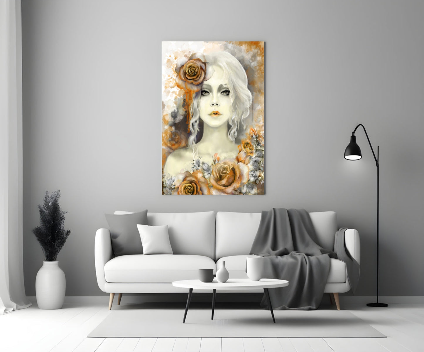 Yellow and gold rose glass wall art featuring a pale woman with white wavy hair displayed above a gray sofa in a modern living room.