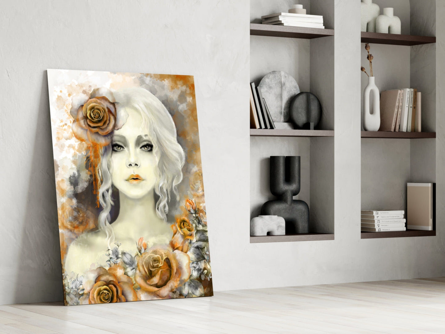 Glass wall art leaning against white wall displays pale woman with white wavy hair surrounded by golden roses and watercolor background.