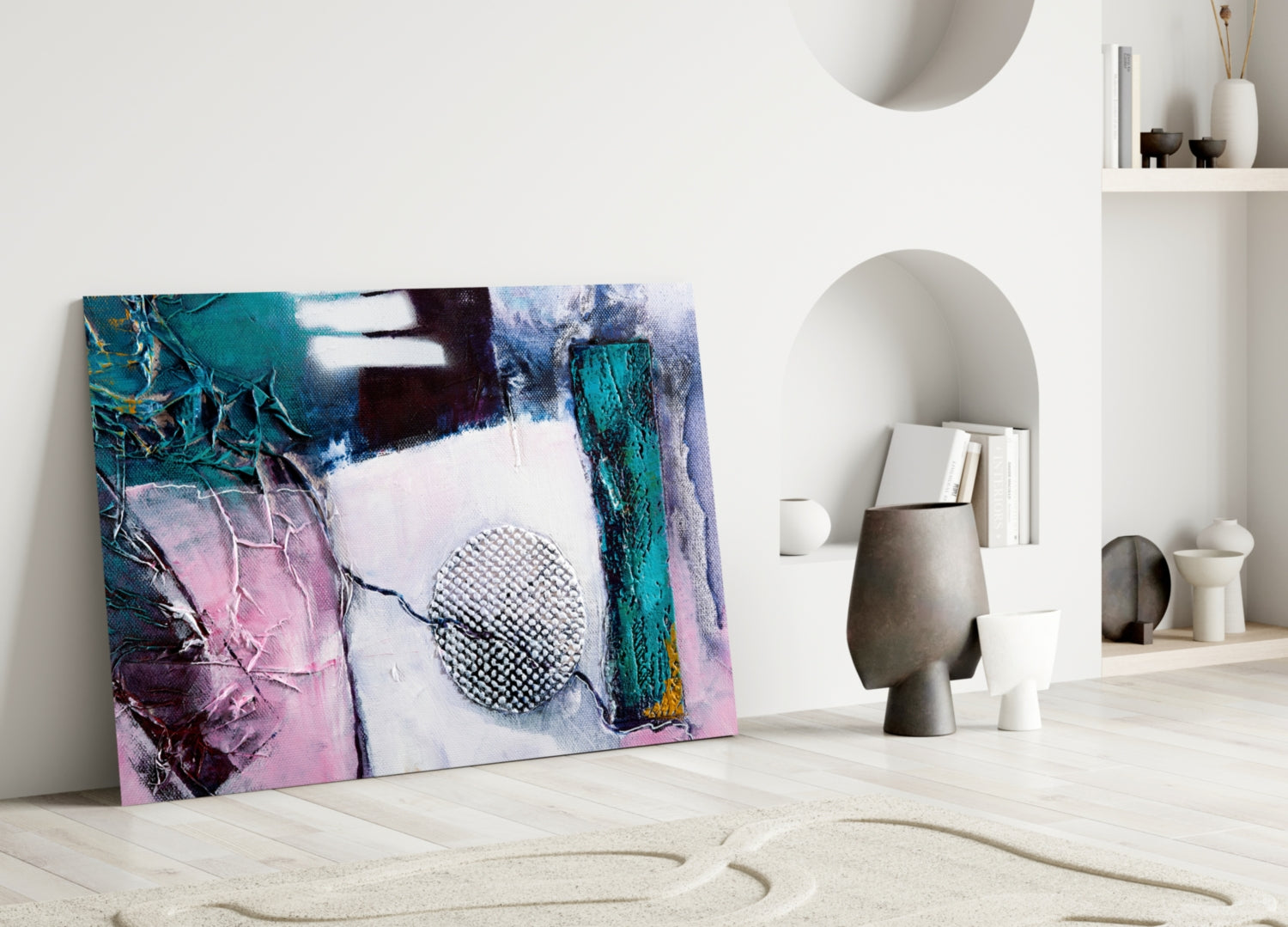 Abstract glass wall art featuring turquoise, pink, and purple colors with geometric patterns, displayed against white interior wall shelving.