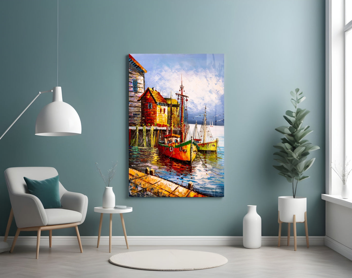 Colorful glass wall art depicting red and yellow boats docked at wooden buildings displayed in a modern living room setting.