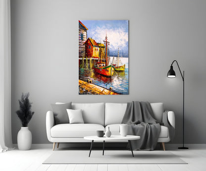 Colorful glass wall art depicting red and yellow boats docked at wooden structures by water, displayed above a white sofa in a modern living room.