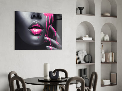 Pink Painted Woman glass wall art displayed above a round dining table in a modern interior with built-in shelving.