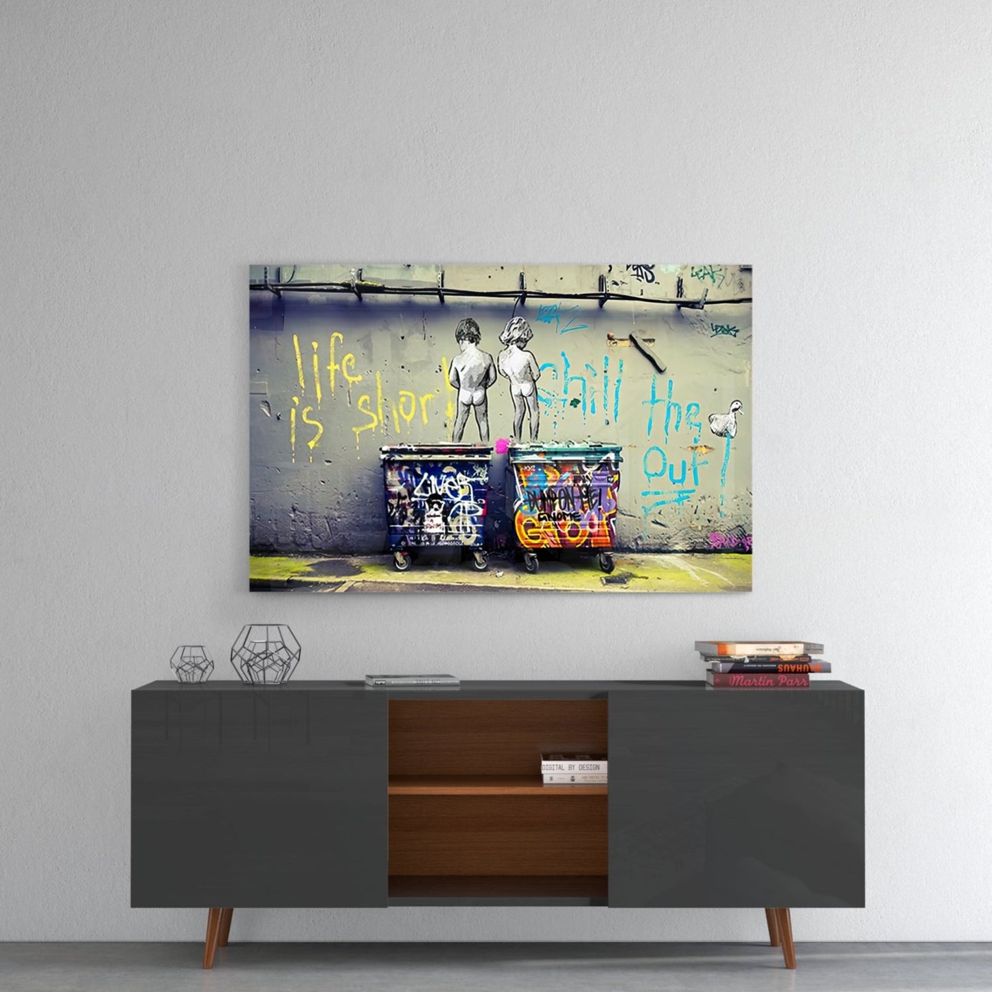 Colorful street art glass wall art hanging above mid-century modern gray sideboard with wooden interior shelving.