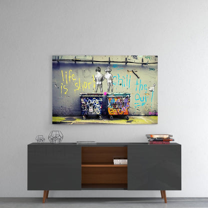 Colorful street art glass wall art hanging above mid-century modern gray sideboard with wooden interior shelving.