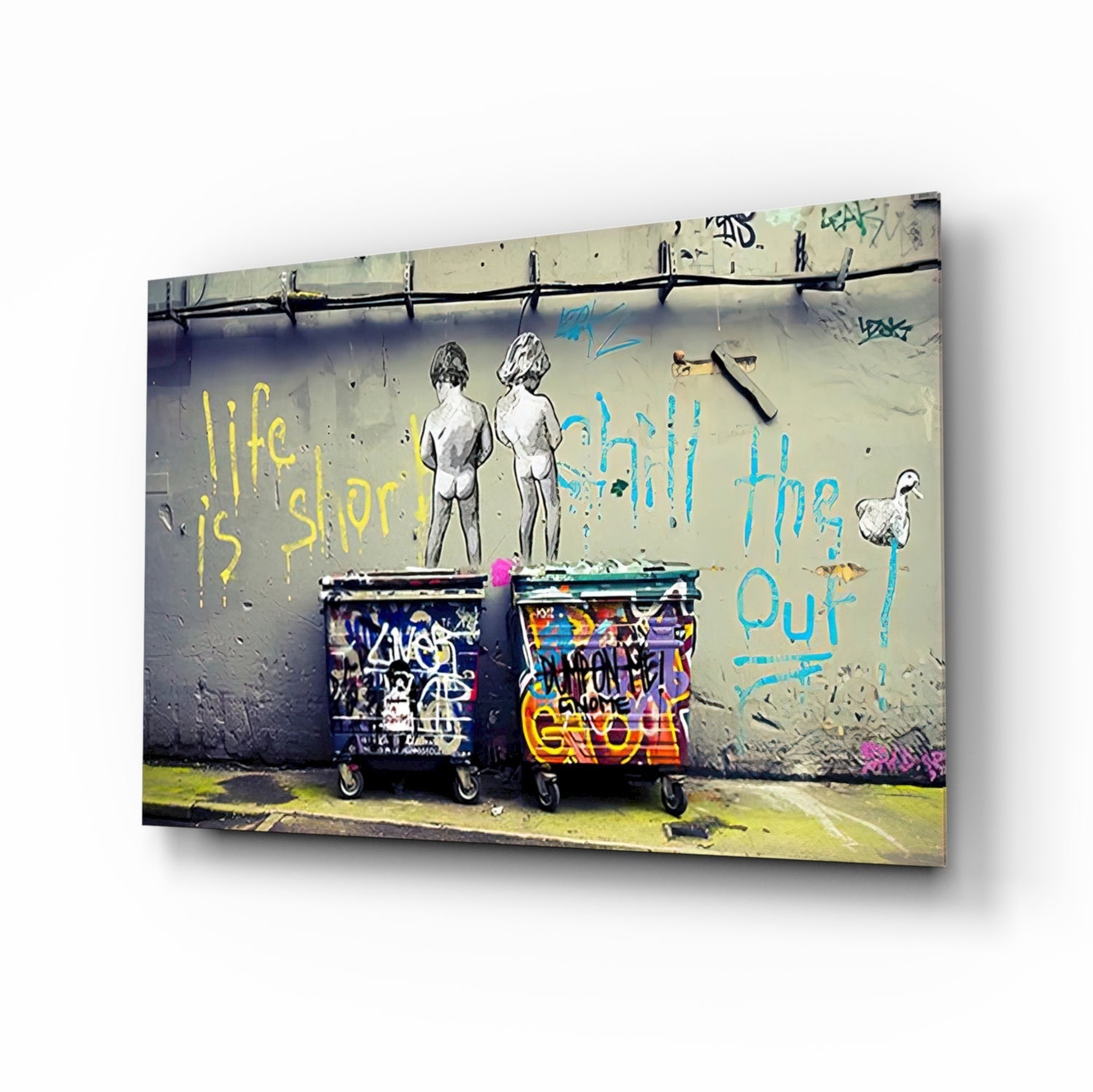 Street art mural on concrete wall showing two nude figures above graffitied trash bins with yellow and blue text reading "life is short" and "chill the out.