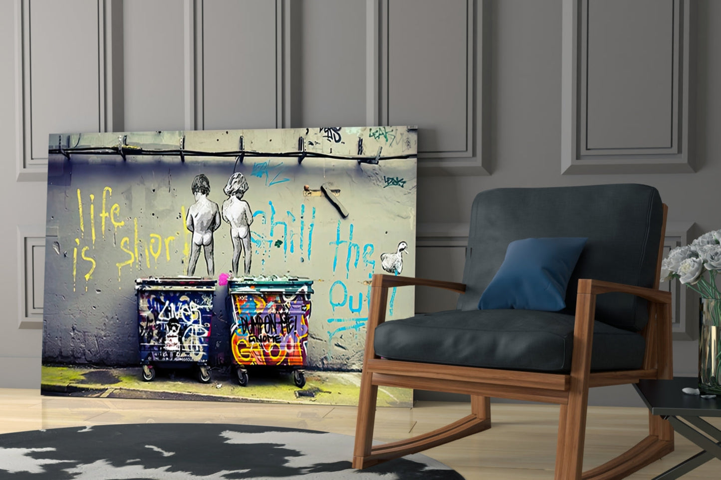 Glass wall art displaying graffiti-style street art with two figures, colorful trash cans, and yellow and blue text reading "life is short" and "chill the out," mounted in modern room setting.