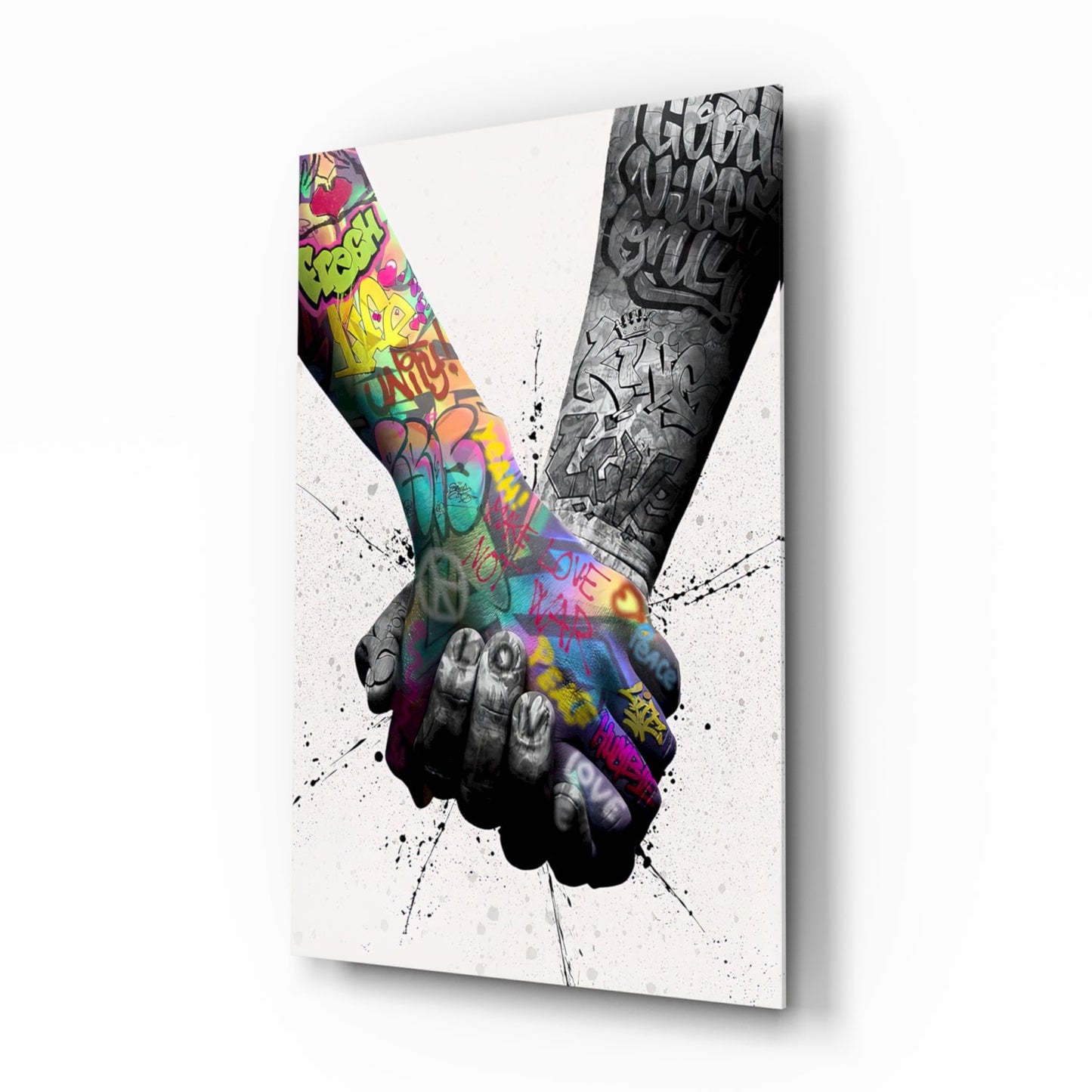 Two arms forming a V-shape with colorful graffiti on left arm and monochrome graffiti on right arm against white background.
