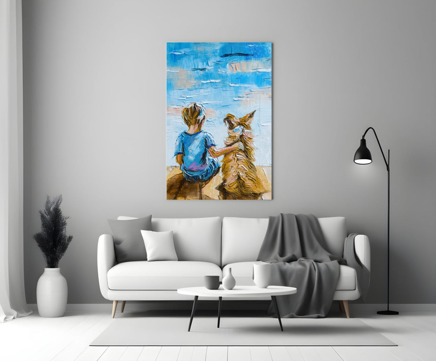 Friendship Glass Wall Art displayed above a white sofa in a modern living room, showing a child and golden dog facing a blue sky.