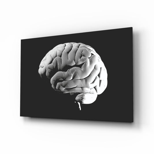 Side profile of engraved white brain on black glass panel displayed at angle against white background.
