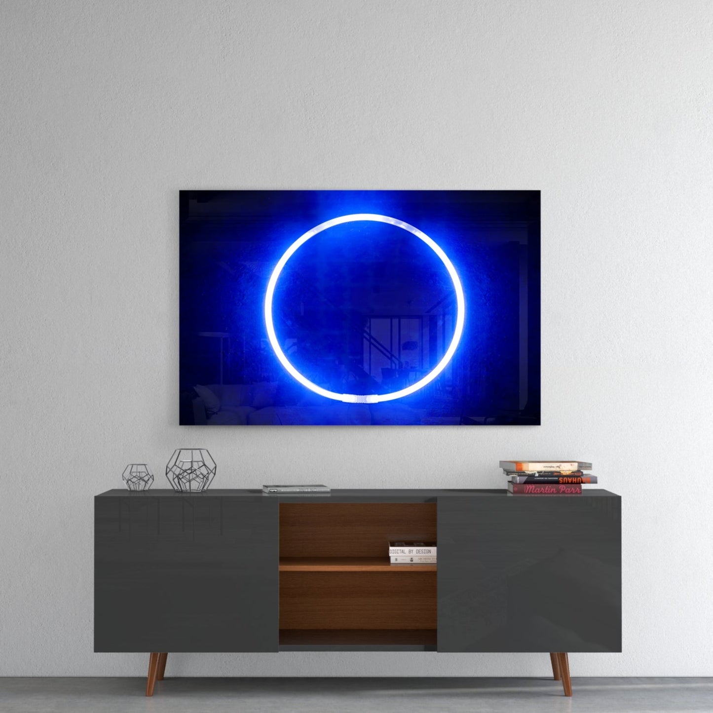 Illuminated blue neon circle displayed on wall above mid-century modern gray dresser with wooden shelving and decorative items.
