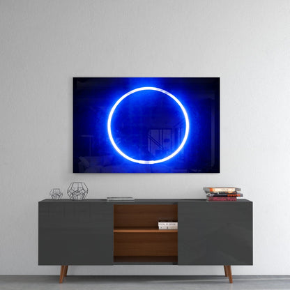 Illuminated blue neon circle displayed on wall above mid-century modern gray dresser with wooden shelving and decorative items.