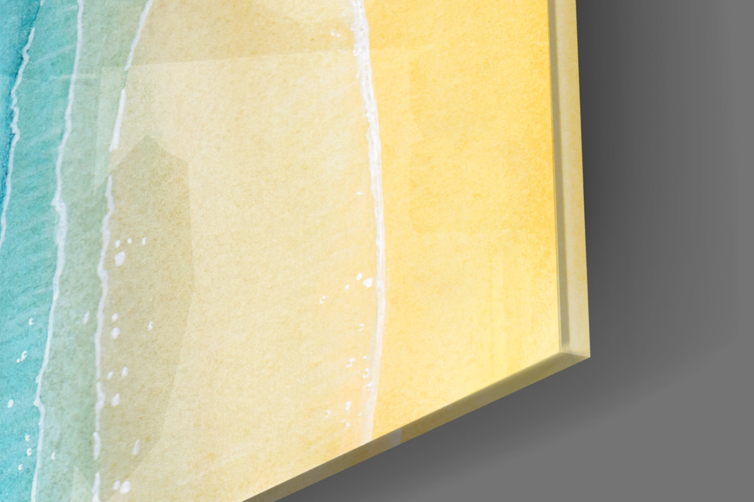 Angled view of sea sand glass wall art showing gradient color transitions from turquoise to yellow with white wave details.