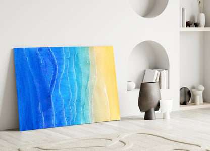 Sea Sand Glass Wall Art leaning against white wall displaying blue-to-yellow gradient waves texture in minimalist interior setting.