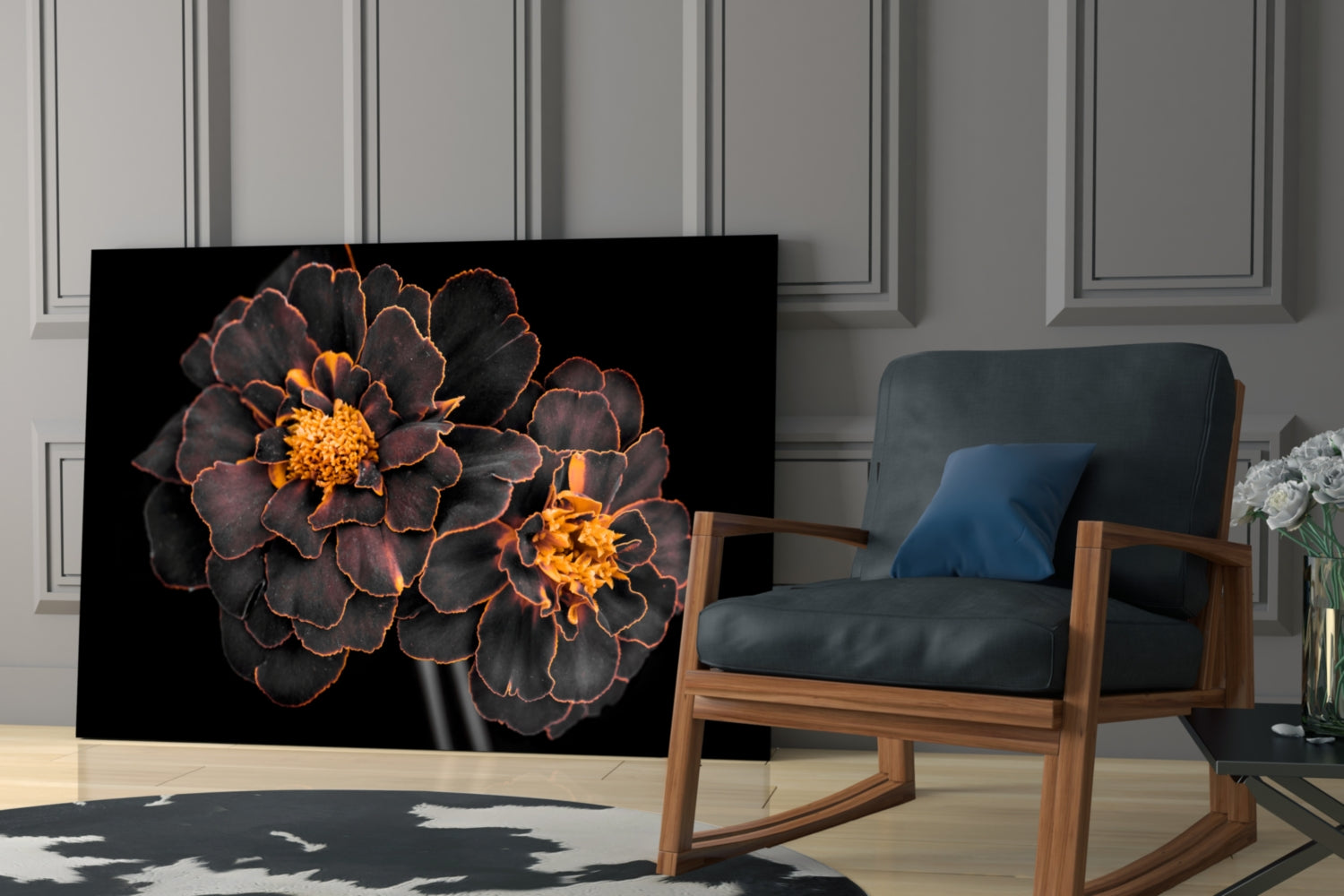 Brown flower glass wall art with orange-edged petals displayed in modern living room next to wooden chair.