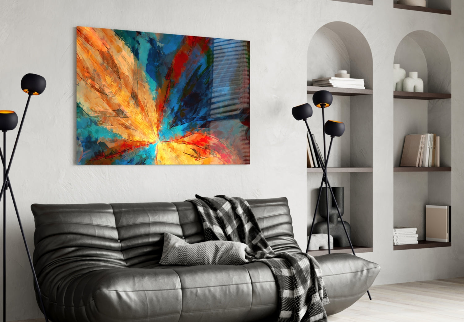 Colorful abstract fractal flower glass art hanging above a black leather sofa in a modern living room interior.
