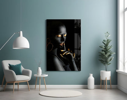 Silent Woman Glass Wall Art displayed on pale blue wall above white chair in modern living room setting.