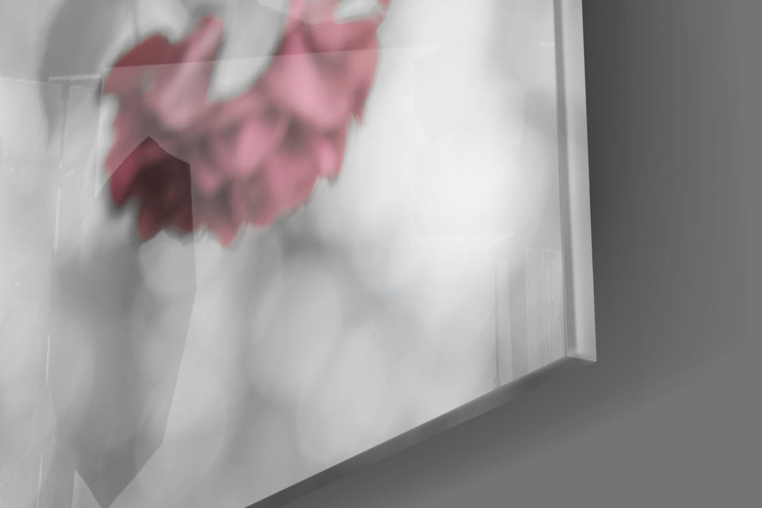 Close-up detail of pink roses printed on frosted glass surface, showing soft focus floral design with red and pink petals.